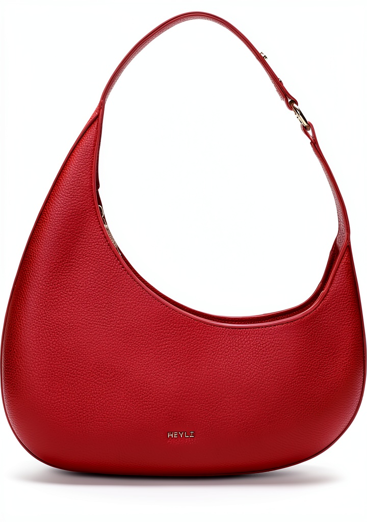 Keyli Luxury Leather Shoulder Bag on a wooden desk with laptop and wallet
