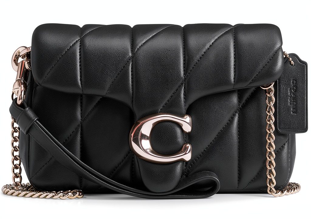 Coach Tabby Wristlet Crossbody Bag One Size Chalk displayed on a marble countertop with accessories